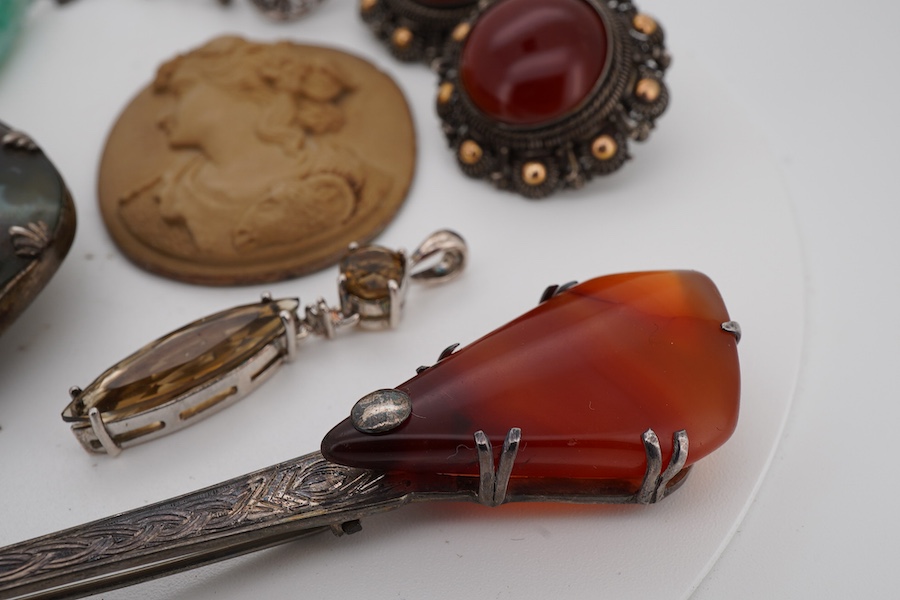 A small group of Victorian and later jewellery, including a white metal mounted bloodstone brooch, 57mm, lave cameo, rings, etc.